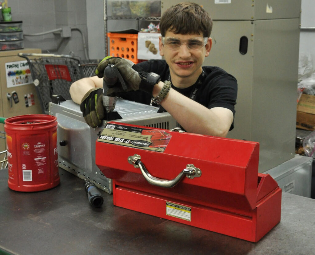 Electronics recycling and repair services performed by team member at Golden Rule Industries