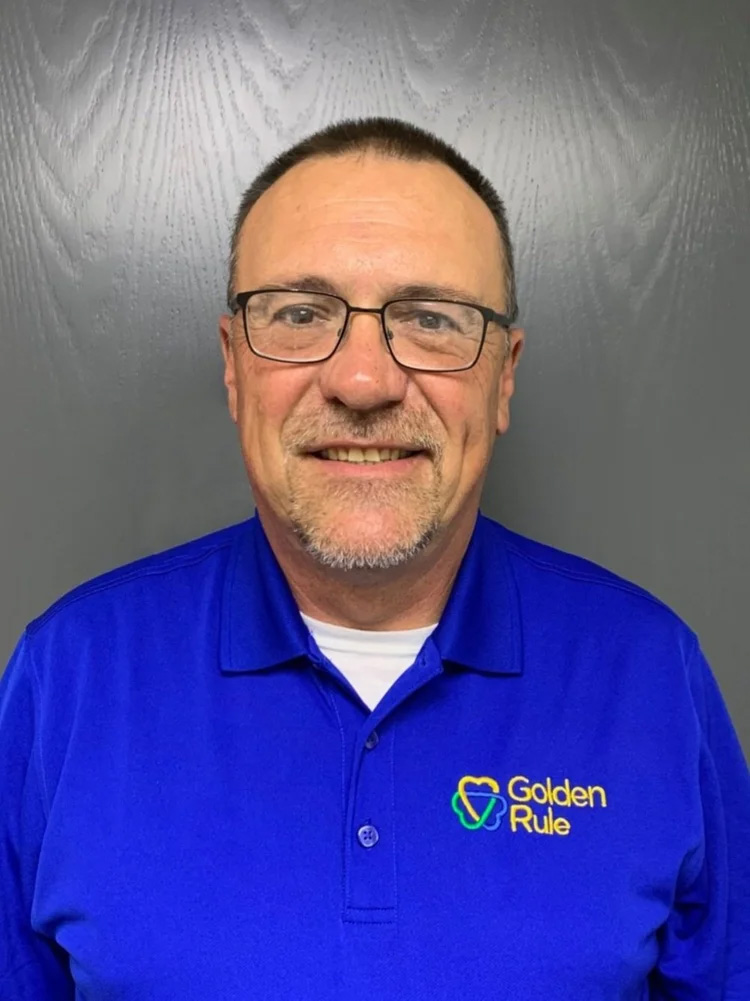 Shane Greer, Chief People Officer at Golden Rule Industries, smiling portrait