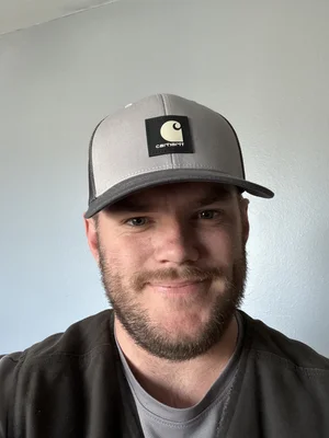 Jacob Greer, job coach at Golden Rule Industries, smiling portrait